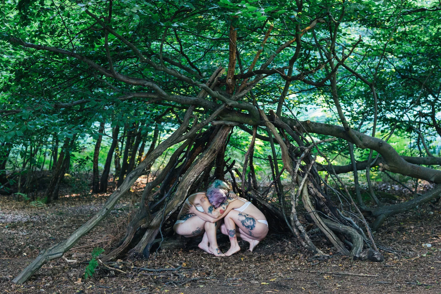 Forest tree roots woman lying fairy tale – Portrait
