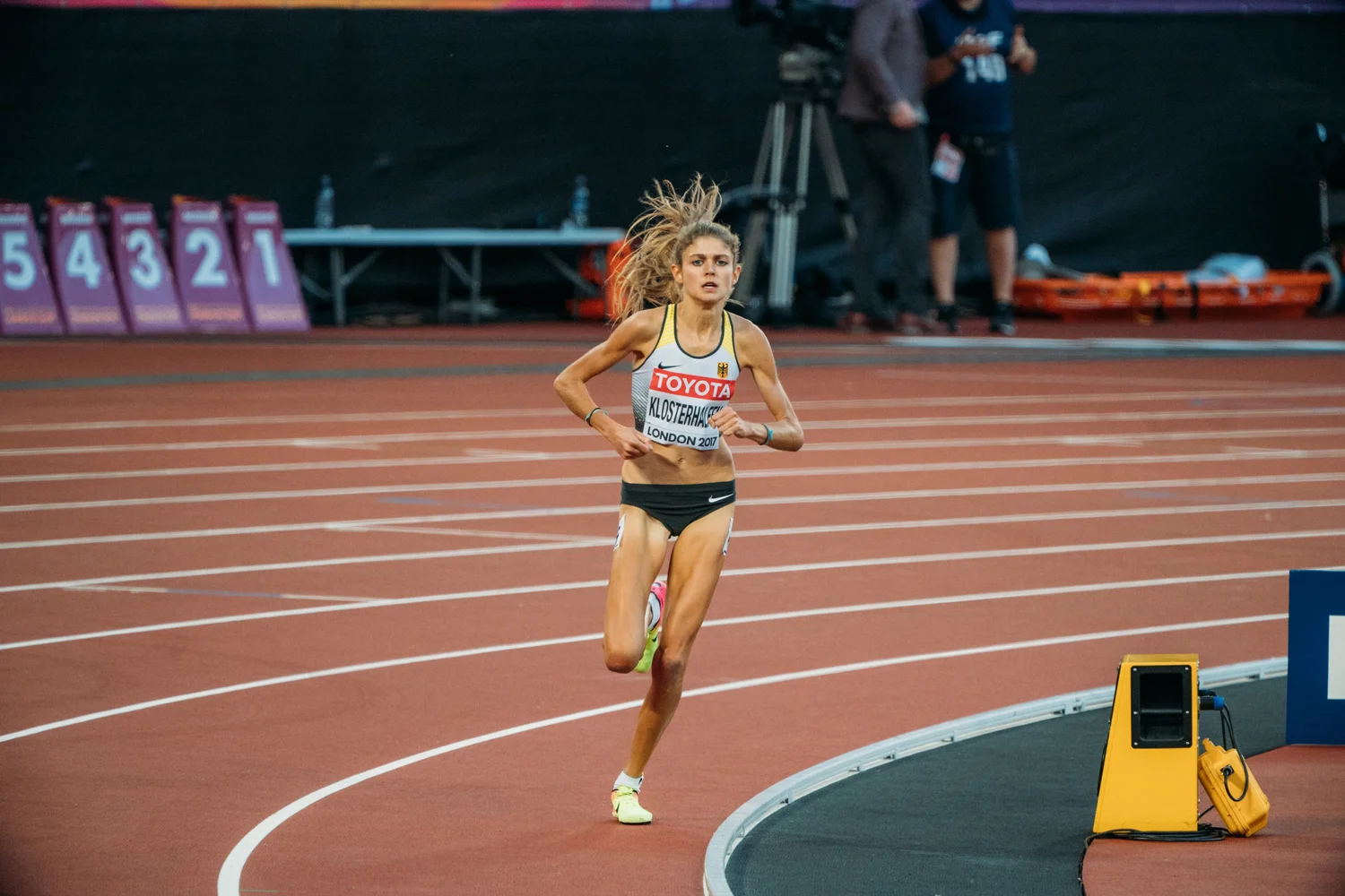 Athletics woman running track race stadium – Sports