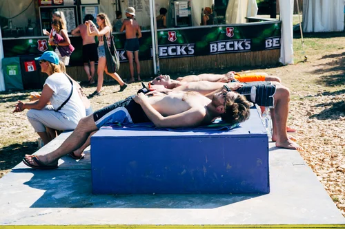 Sunbathing men bench shirtless summer street – Street
