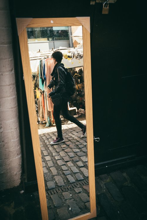 Mirror reflection street doorway man – Street