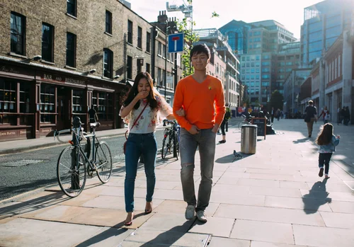 Street couple walking city sunny london – Street