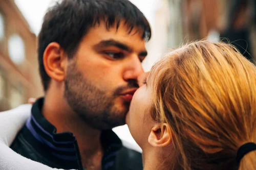 Couple kiss love close-up romance – Street