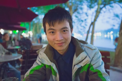 Vietnam man portrait night market smiling – Vietnam