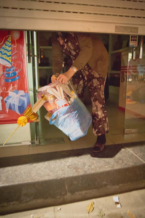 Vietnam woman doorway night street carrying – Vietnam