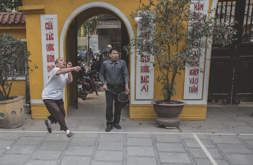 Vietnam men playing shuttlecock da cau street – Vietnam