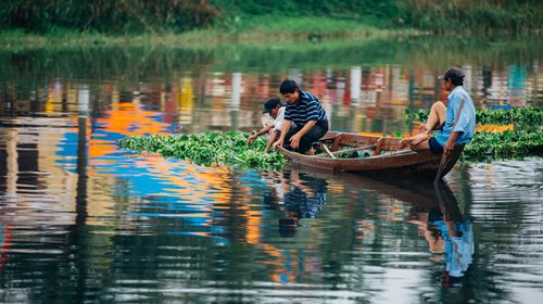 Vietnam river boats fishermen reflection water – Vietnam