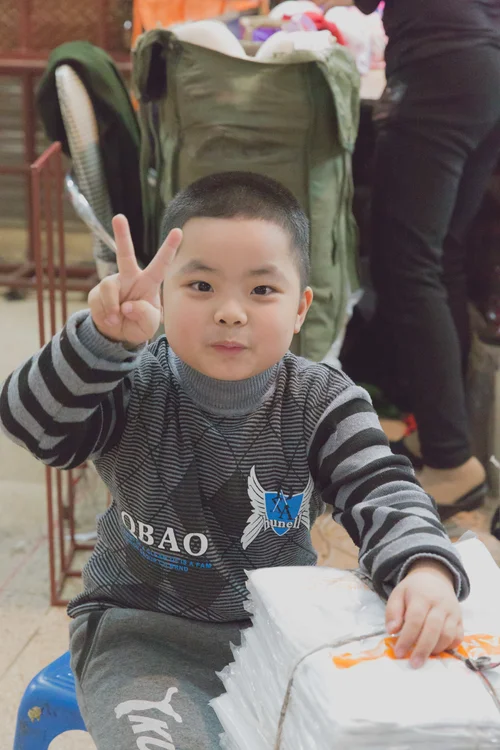 Vietnam boy child peace sign portrait – Vietnam
