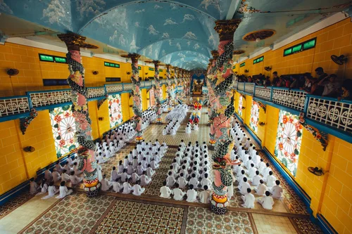 Vietnam cao dai temple interior colourful columns – Vietnam