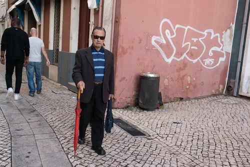 Portugal street men walking pink wall graffiti – Portugal