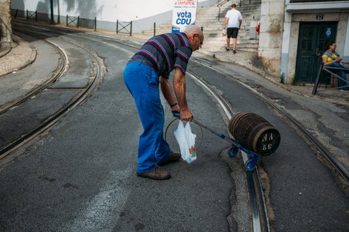 Portugal man carrying water bottles street lisbon – Portugal