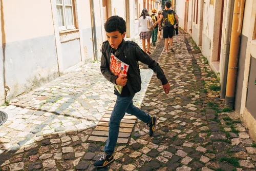 Portugal boy running cobblestones street lisbon child – Portugal