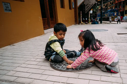 Peru children playing street cobblestones cusco – Peru