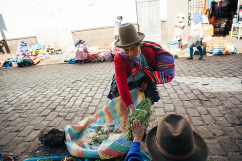 Peru woman traditional dress market cusco street – Peru