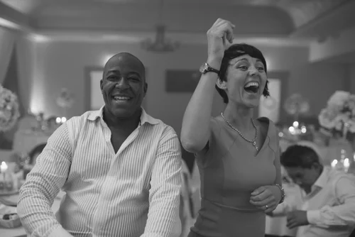 Wedding reception guests cheering laughing black and – Wedding Photography