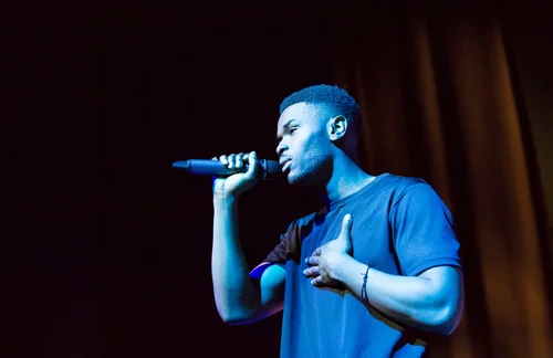 Singer man blue light stage microphone concert – Cynical headliner show