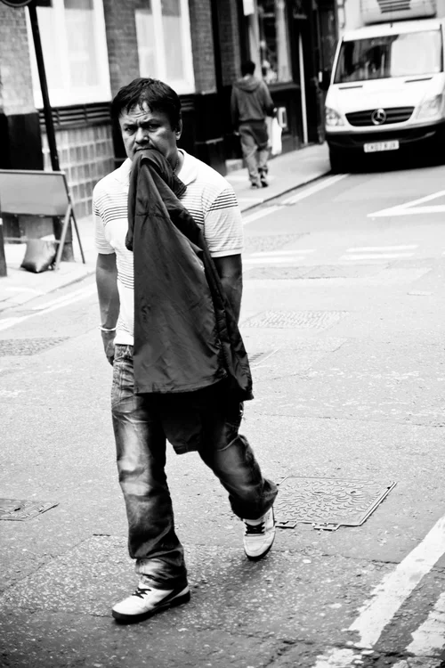 Street man black and white walking london – Street