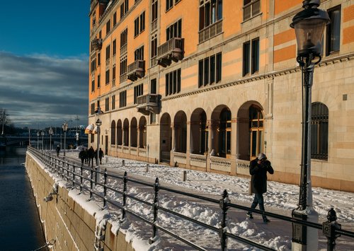 Stockholm street snow buildings winter people walking – Stockholm
