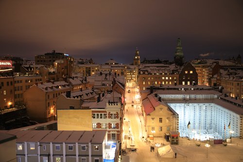 Stockholm night snow city rooftops church lights – Stockholm