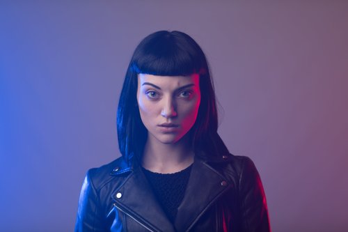 Woman blue purple neon light leather jacket – Fashion & Portrait Photography