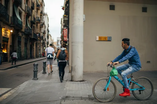 Barcelona street cyclist bicycle old town people – Barcelona