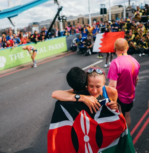 Marathon finish hug flag athletes emotion london – Sports & Event Photography