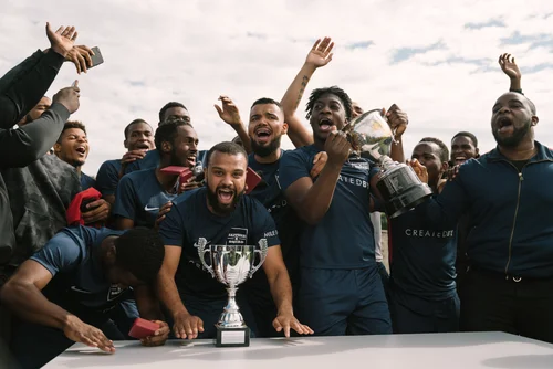 Football team celebration trophy cup winners crowd – Sports & Event Photography
