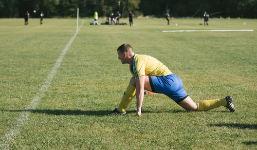Grass roots football hackney marshes player stretching – Day 3 - Referee's insight and warm-up