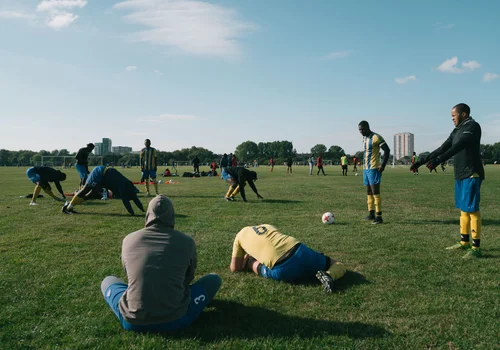 Grass roots football hackney marshes players stretching – Day 3 - Referee's insight and warm-up
