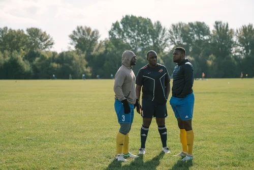 Grass roots football hackney marshes players talking – Day 3 - Referee's insight and warm-up