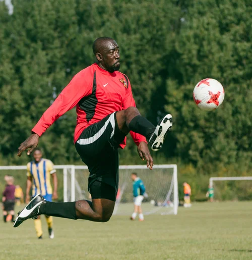 Grass roots football hackney marshes player volley – Sports & Event Photography